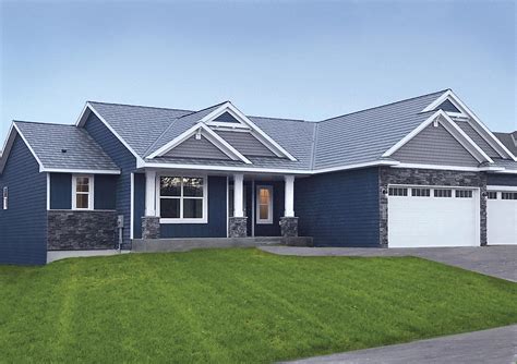 blue gray house with metal roof|black roof with gray siding.